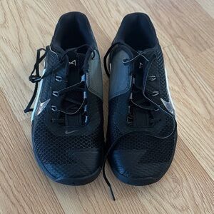 Nike women's Black Athletic Sneakers with Silver Swoosh